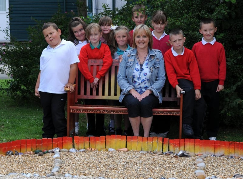 Hedworthfield Primary School pupils with artist Jacquie Boyd and the sculpture they created in the school grounds in 2010.
