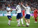 Jack Grealish celebrates with Callum Wilson and Marcus Rashford  after scoring their team's sixth goal during the FIFA World Cup Qatar 2022 Group B match between England and IR Iran at Khalifa International Stadium on November 21, 2022 in Doha, Qatar. (Photo by Matthias Hangst/Getty Images)