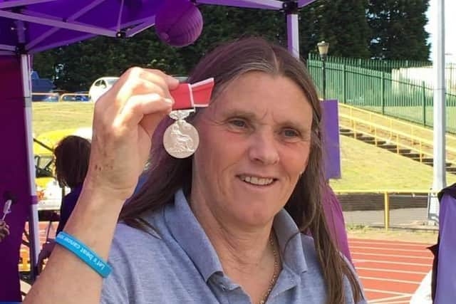 Ann Walsh with her British Empire Medal