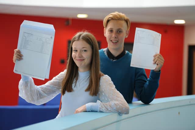 Jarrow School student Jessica Stonehouse and Dwight Davies with their GCSE results.