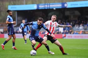 HIGH WYCOMBE, ENGLAND - JANUARY 08: Carl Winchester of Sunderland tackles Josh Scowen of Wycombe Wanderers during the Sky Bet League One match between Wycombe Wanderers and Sunderland at Adams Park on January 08, 2022 in High Wycombe, England. (Photo by Alex Burstow/Getty Images)