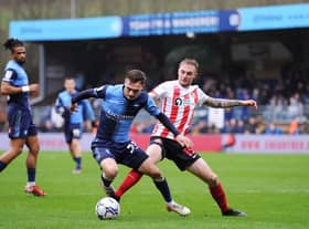 HIGH WYCOMBE, ENGLAND - JANUARY 08: Carl Winchester of Sunderland tackles Josh Scowen of Wycombe Wanderers during the Sky Bet League One match between Wycombe Wanderers and Sunderland at Adams Park on January 08, 2022 in High Wycombe, England. (Photo by Alex Burstow/Getty Images)