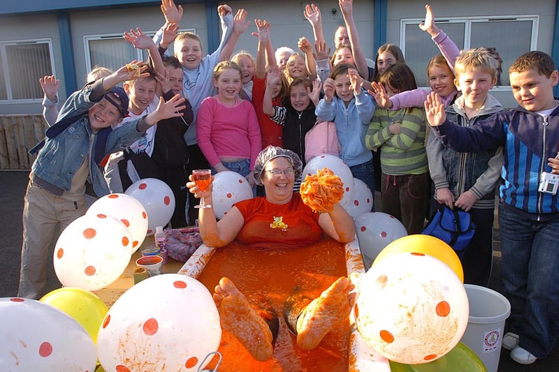 We are turning the clock back 14 years for this Children In Need scene. It shows staff and children at Howetch School in Peterlee as they enjoyed a bath - filled with tomatoes! Remember it?