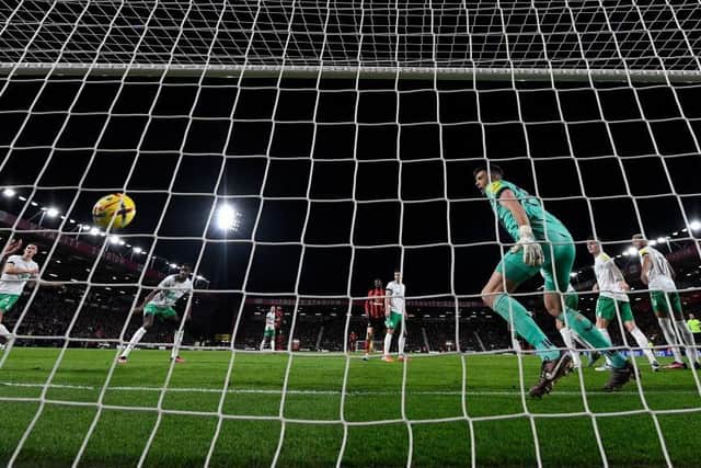 Bournemouth's Argentinian defender Marcos Senesi (L) scores the opening goal past Newcastle United's English goalkeeper Nick Pope during the English Premier League football match between Bournemouth and Newcastle United at the Vitality Stadium in Bournemouth, southern England on February 11, 2023. (Photo by GLYN KIRK/AFP via Getty Images)