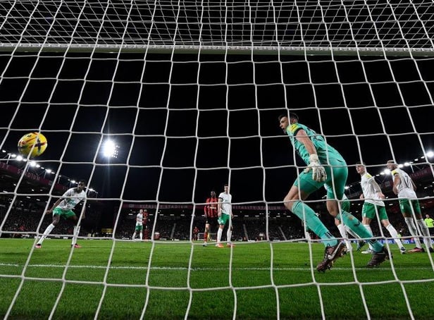 Bournemouth's Argentinian defender Marcos Senesi (L) scores the opening goal past Newcastle United's English goalkeeper Nick Pope during the English Premier League football match between Bournemouth and Newcastle United at the Vitality Stadium in Bournemouth, southern England on February 11, 2023.  (Photo by GLYN KIRK/AFP via Getty Images)