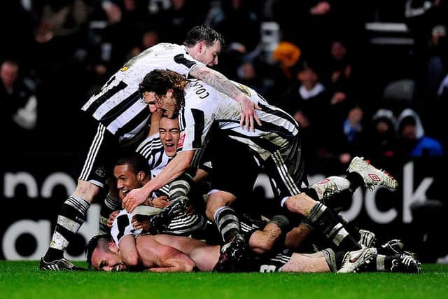 Jose Enrique is mobbed after scoring his only Newcastle United goal against Nottingham Forest.