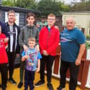 Chris Convery, left, and Cllr Ernest Gibson, right, with users of the Holder House Allotment project.