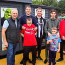 Chris Convery, left, and Cllr Ernest Gibson, right, with users of the Holder House Allotment project.