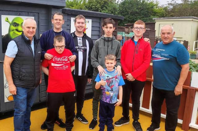 Chris Convery, left, and Cllr Ernest Gibson, right, with users of the Holder House Allotment project.