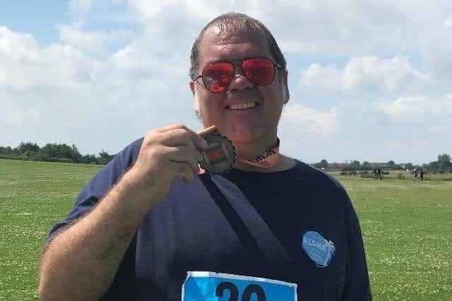 Wayne pictured on a previous fundraising challenge.