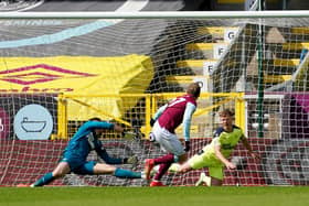 Matej Vydra of Burnley scores their team's first goal past Martin Dubravka and Matt Ritchie of Newcastle United during the Premier League match between Burnley and Newcastle United at Turf Moor on April 11, 2021 in Burnley, England.