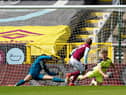 Matej Vydra of Burnley scores their team's first goal past Martin Dubravka and Matt Ritchie of Newcastle United during the Premier League match between Burnley and Newcastle United at Turf Moor on April 11, 2021 in Burnley, England.