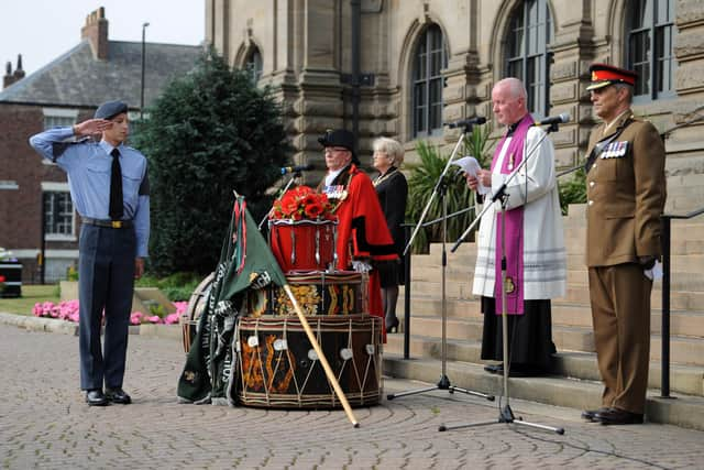 A bouquet of poppies were placed on the drum altar during the service.