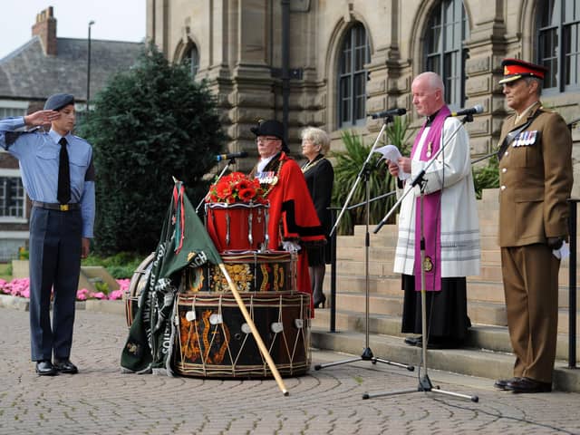A bouquet of poppies were placed on the drum altar during the service.