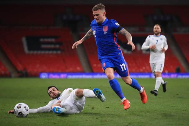 Kieran Trippier of England is challenged by Luca Ceccaroli of San Marino during the FIFA World Cup 2022 Qatar qualifying match between England and San Marino at Wembley Stadium on March 25, 2021 in London, England.  (Photo by Adam Davy - Pool/Getty Images)