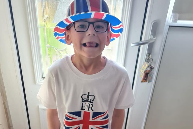 Thomas Robins, age 7, dons his Union Jack hat.
