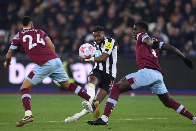 Allan Saint-Maximin of Newcastle United shoots under pressure from Thilo Kehrer of West Ham United and Kurt Zouma of West Ham United  during the Premier League match between West Ham United and Newcastle United at London Stadium on April 05, 2023 in London, England. (Photo by Justin Setterfield/Getty Images)