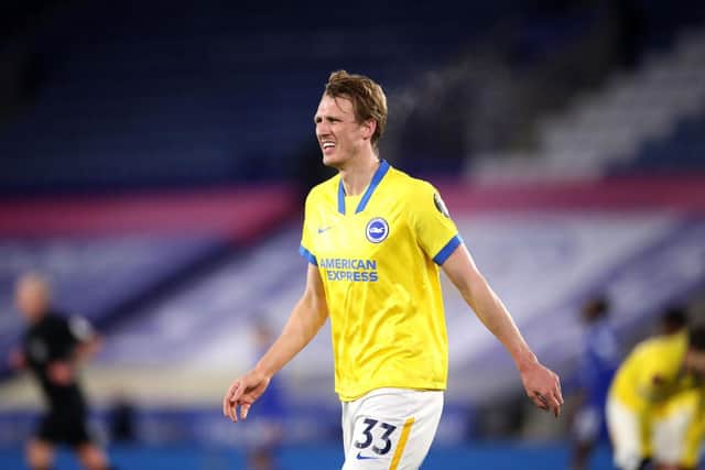 Dan Burn of Brighton & Hove Albion reacts during The Emirates FA Cup Fifth Round match between Leicester City and Brighton And Hove Albion at The King Power Stadium on February 10, 2021 in Leicester, England. Sporting stadiums around the UK remain under strict restrictions due to the Coronavirus Pandemic as Government social distancing laws prohibit fans inside venues resulting in games being played behind closed doors. (Photo by Alex Pantling/Getty Images)