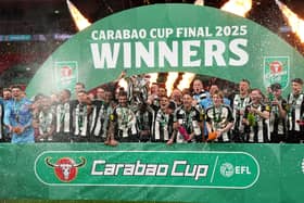Newcastle United's Bruno Guimaraes (left) and Kieran Trippier lift the Carabao Cup trophy with team-mates following victory at Wembley Stadium over Liverpool. (Photo by Owen Humphreys/PA Wire)
