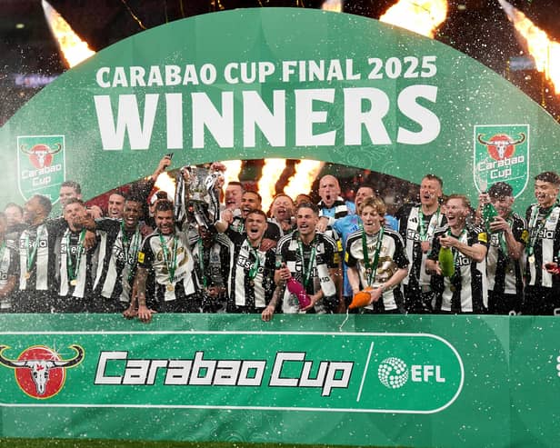 Newcastle United's Bruno Guimaraes and Kieran Trippier lift the Carabao Cup trophy with team-mates following victory at Wembley Stadium over Liverpool. (Photo by Owen Humphreys/PA Wire)