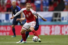 Denmark's Christian Eriksen controls the ball during the Euro 2020 soccer championship group B match between Denmark and Finland at Parken Stadium in Copenhagen, Saturday, June 12, 2021. (Stuart Franklin/Pool via AP)