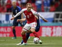 Denmark's Christian Eriksen controls the ball during the Euro 2020 soccer championship group B match between Denmark and Finland at Parken Stadium in Copenhagen, Saturday, June 12, 2021. (Stuart Franklin/Pool via AP)