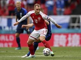 Denmark's Christian Eriksen controls the ball during the Euro 2020 soccer championship group B match between Denmark and Finland at Parken Stadium in Copenhagen, Saturday, June 12, 2021. (Stuart Franklin/Pool via AP)