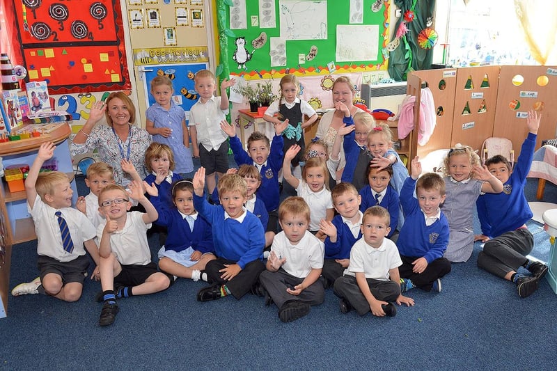 St Bega's Nursery and Reception pupils and teachers celebrating an outstanding Ofsted report 6 years ago.