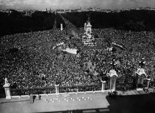 15th August 1945:  The view which greeted the King from Buckingham Palace on VJ Day. As far as the eye can see jubilant crowds stretch from Queen Victoria's monument along the Mall.  (Photo by Keystone/Getty Images)