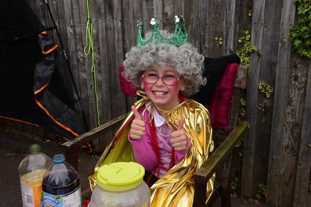 Eight-year-old Blossom Watkins was Queen for the day in Orchid Gardens