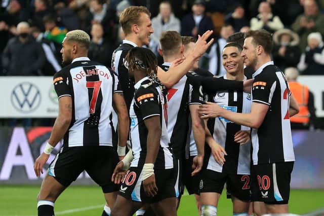 How has Newcastle United's victory over Wolves affected their survival hopes? (Photo by LINDSEY PARNABY/AFP via Getty Images)