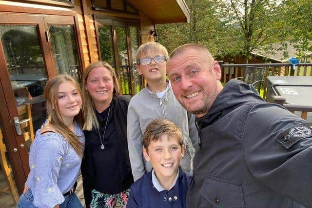 Ethan Adams, pictured here in grey top, with his parents Mark and Tracey and siblings Ellie and Evan.