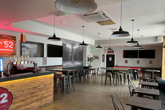 The sports-themed Bar 52 is part of the package on sale.