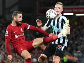 Liverpool's English midfielder Jordan Henderson (L) vies with Newcastle United's English midfielder Sean Longstaff (R) during the English Premier League football match between Liverpool and Newcastle United at Anfield in Liverpool, north west England on August 31, 2022.(Photo by PAUL ELLIS/AFP via Getty Images)