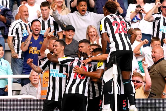 Newcastle United's Miguel Almiron celebrates with his team-mates after scoring against Manchester City.