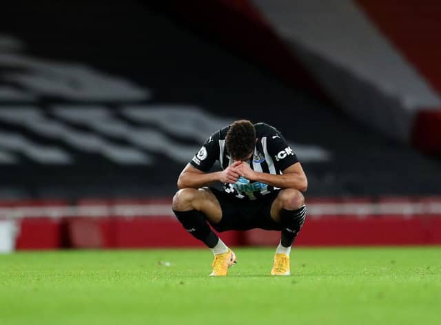 Joelinton of Newcastle United looks dejected.