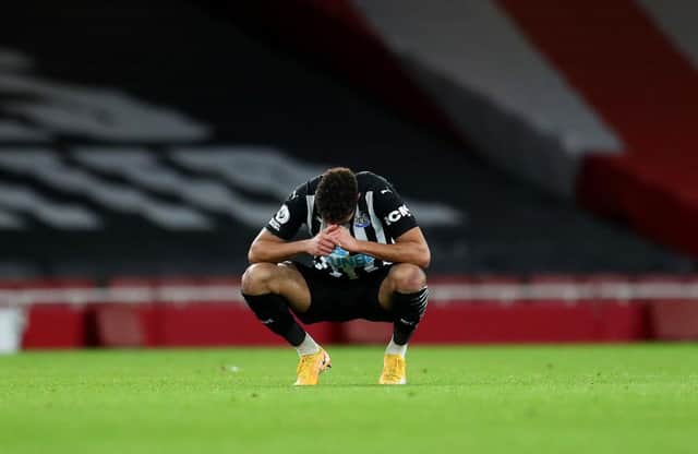 Joelinton of Newcastle United looks dejected.