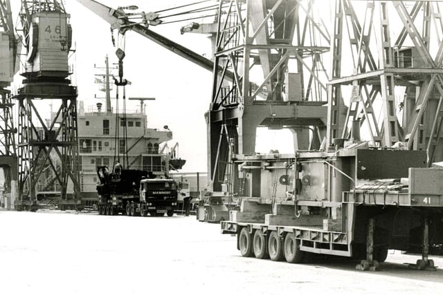 Large sections of machinery are loaded onto trailers at the Victoria dock. Did you work there in 1991?