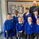 Headteacher Dominic Woodhouse with pupils at St Oswald’s Catholic Primary School, South Shields.