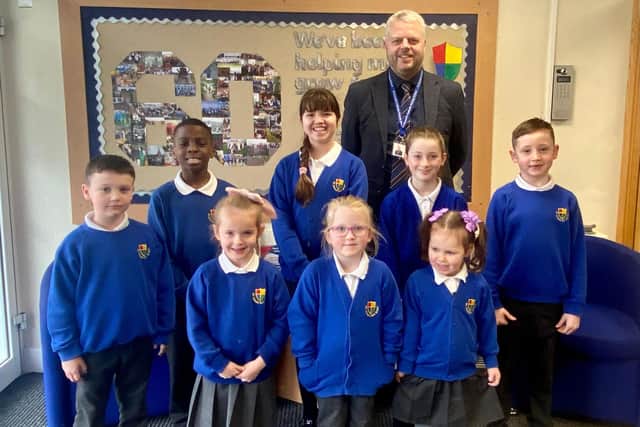 Headteacher Dominic Woodhouse with pupils at St Oswald’s Catholic Primary School, South Shields.