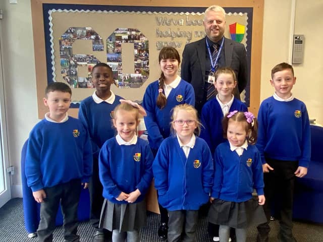 Headteacher Dominic Woodhouse with pupils at St Oswald’s Catholic Primary School, South Shields.