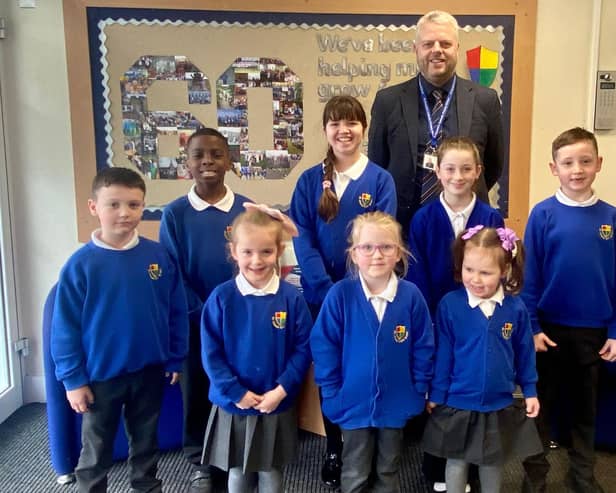Headteacher Dominic Woodhouse with pupils at St Oswald’s Catholic Primary School, South Shields.