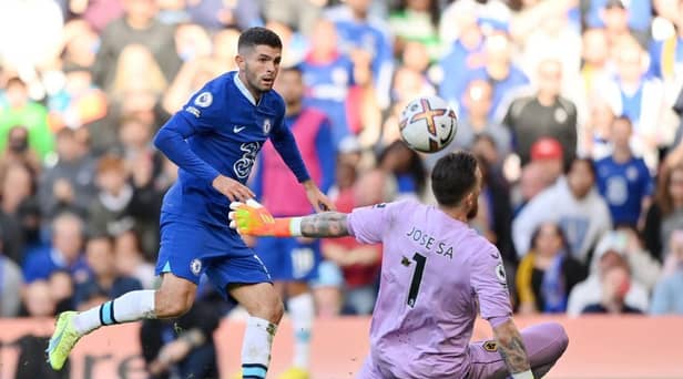 Christian Pulisic of Chelsea scores their side's second goal past Jose Sa of Wolverhampton Wanderers during the Premier League match between Chelsea FC and Wolverhampton Wanderers at Stamford Bridge on October 08, 2022 in London, England. (Photo by Justin Setterfield/Getty Images)
