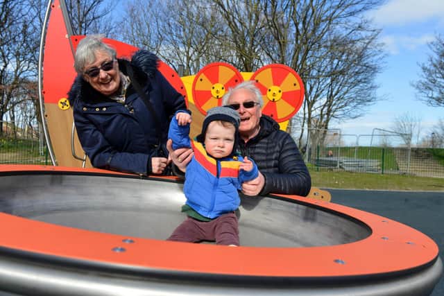 Family fun at the new North Marine Play Park. Great grandparents Jimmy and Lana Flannery with Gruffydd Morris-Campbell, one.