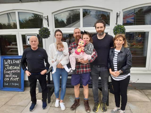 (Left to right) grandfather Bobby Park, Tracy Shaw with baby Delilah Shaw, Jordan Main Thorpe with Sophia Shaw, Matt Shaw and grandmother Jean Statt, outside Dougie's Tavern in Hebburn where Jordan completed his 400 mile fundraising walk.