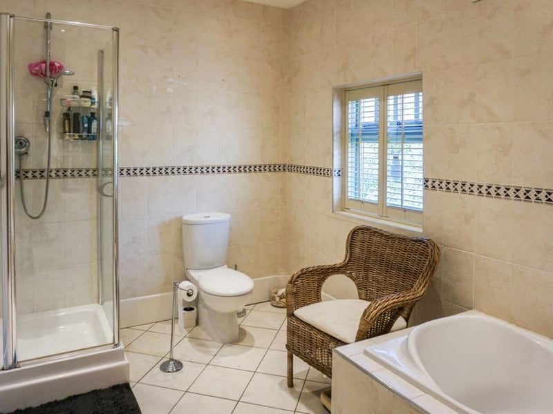 Family bathroom benefits from underfloor heating and is fitted with a luxurious four piece suite.