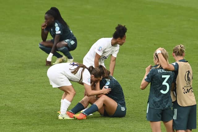 England's Lauren Hemp (centre left) and Demi Stokes (centre) approach Germany's Lena Oberdorf after the Women's Euro 2022 final.