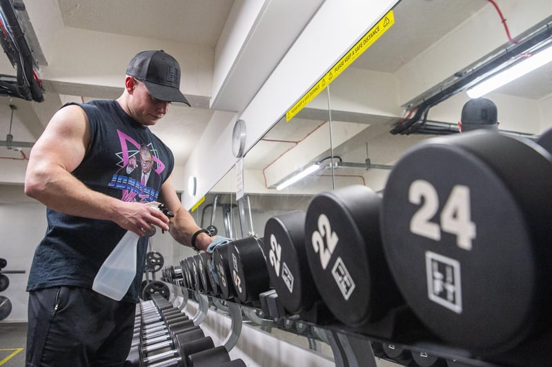 Lift Gym owner Andy Smith is thrilled gyms have been given the green light to reopen. Here he is giving the equipment a wipe down as customers return from today.