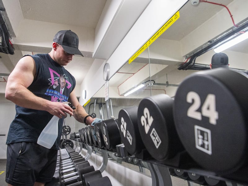 Lift Gym owner Andy Smith is thrilled gyms have been given the green light to reopen. Here he is giving the equipment a wipe down as customers return from today.