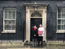 Christopher Head and Kate Osborne MP hand over the petition at 10 Downing Street.